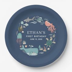 a blue plate with an ocean themed design on it