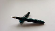 a pen sitting on top of a white table