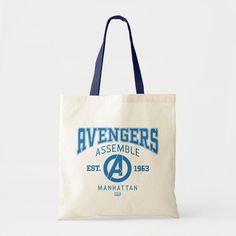 the avengers assemble tote bag is white with blue trim and has an iron man logo on it