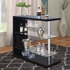 a bar cart with liquor bottles and glasses on it