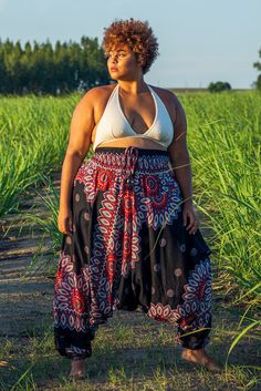 Part of our plus size  range, these black Lotus pants are super comfortable 2-in-1 harem pants which double as a jumpsuit. They are versatile, practical and easy to style. 
 
Pattern 
The print is inspired by a Thai spiritual symbol, the lotus flower. Dual color petals adorn the waist and lower legs down to the anklets. The pattern is bold yet projects a calm and tranquil feel. 
 
100% Vegan & Fairtrade 
As with all our pants, these lotus pants are made from vegan-friendly material. Bamboo rayon Plus Size Boho Grunge Outfits, Flower Pants Outfit, Harem Pants Diy, Spiritual Outfits, Plus Size Hippie Fashion, Harem Pants Outfit, Plus Size Harem Pants, Plus Size Hippie, Boohoo Style