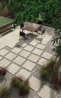 a table and chairs sitting on top of a stone patio