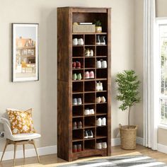 a tall wooden shoe rack in a living room next to a chair and potted plant