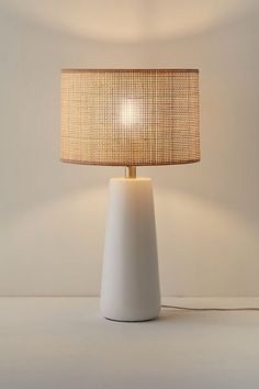 Create a serene, coastal scene in your space with this table lamp. Features a round ceramic base with a natural rattan drum shade that offers a warm feel to your lighting essentials. Equipped with a 3-way rotary switch that allows you to easily adjust the brightness to fit your needs. Plugs in to power on. Features Boho coastal table lamp Ceramic base Natural woven rattan drum shade Plug in 3-Way rotary switch Compact fluorescent compatible Requires one E26 Type A 100W 3-way bulb - not included Bed Side Table Decor, Boho Table Lamp, Modern Lamps Bedroom, Beach Lamps, Modern Nightstand Lamps, Bedroom Lamps Nightstand, Coastal Lamp, Coastal Table, Rattan Floor Lamp