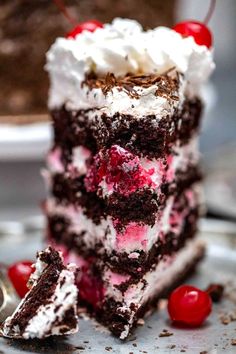 a piece of cake with cherries on it