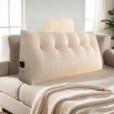 a couch that has a blanket on it