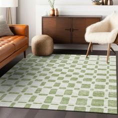 a living room with two couches and a rug on the floor in front of it