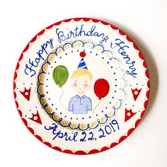 a birthday plate with a boy and balloons on it