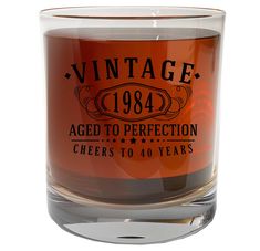 an old fashioned glass with the words aged to perfectionion cheers to 40 years printed on it