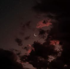 the night sky is filled with clouds, stars and a half moon in the distance