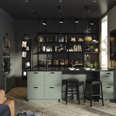 a kitchen with two bar stools in front of it and shelves on the wall