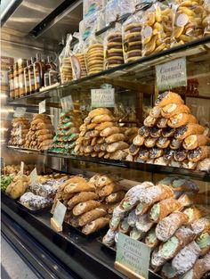 a display case filled with lots of different kinds of pastries