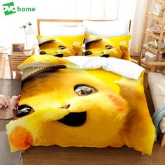 a bed with two pillows and a yellow cat face on the comforter, next to a window