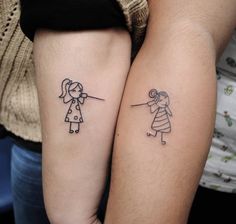 two people with matching tattoos on their arms