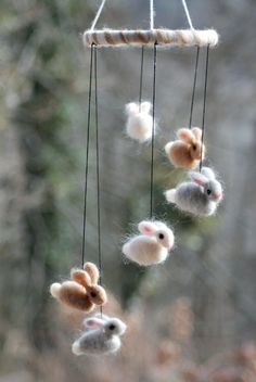 several small stuffed animals hanging from a string