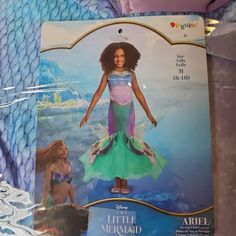 the little mermaid doll is in its package