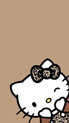 an image of a hello kitty with leopard print on it's head holding a donut