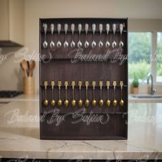 a wooden rack with spoons and forks in it on a kitchen counter next to a window