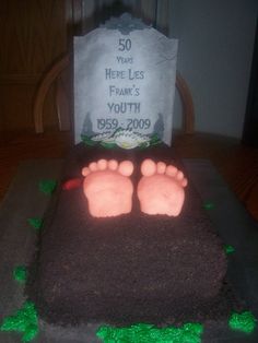 a cake that has been decorated to look like a baby's feet on it