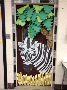 a door decorated with zebras and trees