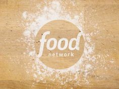 the food network logo is shown on a piece of wood that has been stained white