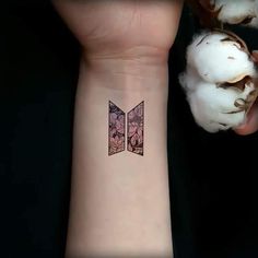 a person with a small tattoo on their wrist