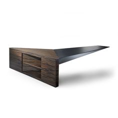 an unusual wooden table with black metal accents