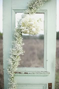 an old door with flowers on it