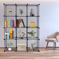 a bookshelf filled with lots of books on top of a hard wood floor