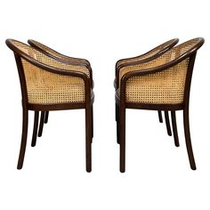 a pair of brown chairs sitting next to each other