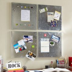 a bulletin board with magnets and pictures on it