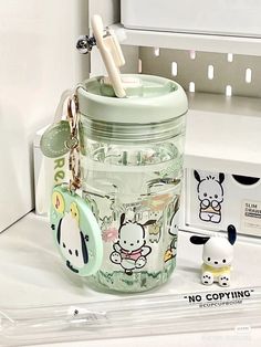 there is a glass jar with some items in it