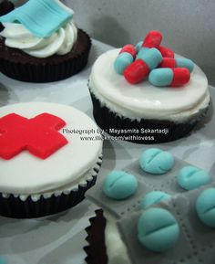 cupcakes decorated with red, white and blue frosting are on a tray