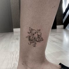 an octopus tattoo on the ankle