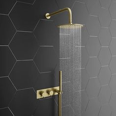 a shower head with thermostaer and hand held shower faucet in gold