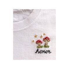 embroidered t - shirt with mushrooms and the word honor on it's chest