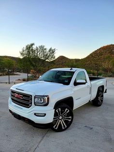 a white truck parked in a parking lot