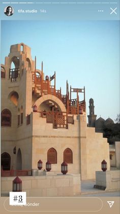 a large building with lots of windows and red lanterns