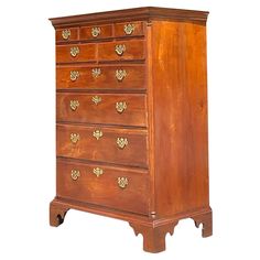 an old wooden dresser with many drawers and knobs on the front, against a white background