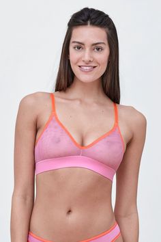 The tringle cups create a natural shape and plunge neckline that will disappear under clothes. The wide bottom band and stretch mesh backs allow for added support and comfort. Complete the look with matching Spellbound pants. Average Coverage Breathable mesh for barely-there feel and natural shape Stretch mesh molded cup Extended triangle cups to enhance flattering plunge neckline Sheer mesh back that is sexy yet comfortable Fully adjustable stretch matte straps and hook and eye for custom fit F Summer Nylon Sports Bra With Mesh Back, Stretch Mesh Bra With Mesh Back, Summer Triangle Top Bra With Light Support, Sheer Pink Bra For Summer, Summer Mesh Sports Bra With Mesh Back, Stretch V-neck Bra For Yoga, Mesh Sports Bra With Built-in Bra For Summer, Stretch V-neck Yoga Bra, Pink Stretch V-neck Bra