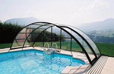 a swimming pool with a glass cover over it