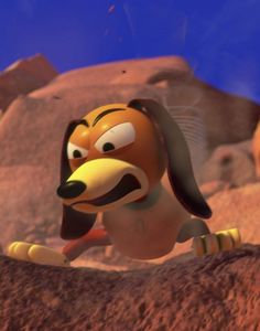 an animated dog is in the middle of a desert area with rocks and boulders behind it