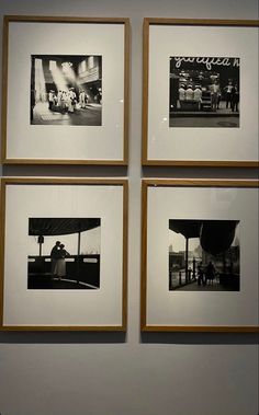 four black and white photographs hanging on the wall