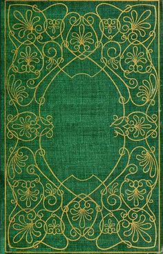 an old green book with gold trimmings and designs on the front cover,