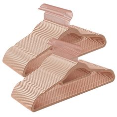 two pieces of pink plastic with wavy lines on them