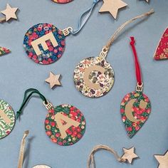 christmas ornaments are laid out on a blue surface