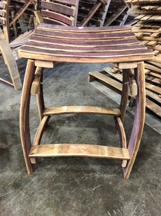 several wooden chairs stacked on top of each other