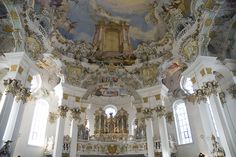 an ornately decorated church with high ceilings