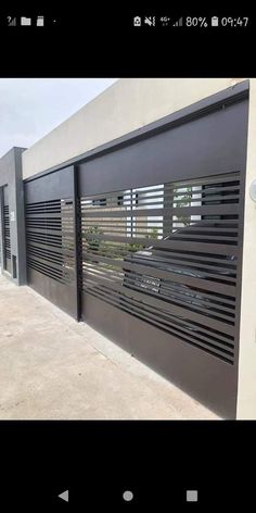 an open garage door with black shutters on it