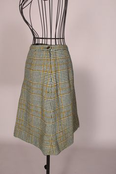 "60s Skirt // Mini Skirt Wonderful vintage 60's green and yellow plaid mini skirt with cute front pleat, by Scaasi for Lortogs! So cute, and in great condition! Waist:24\" Hips:38\" Length:19\" Label: Scaasi for Lortogs 2016-12" Retro Green Skirt For Fall, Retro Green Mini Skirt, Retro Plaid Mini Skirt Bottoms, Retro Plaid Mini Skirt, Retro Yellow Pleated Mini Skirt, Vintage Pleated Mini Skort, Retro Green Knee-length Skirt, Green Retro Knee-length Skirt, Vintage Plaid Pleated Skirt